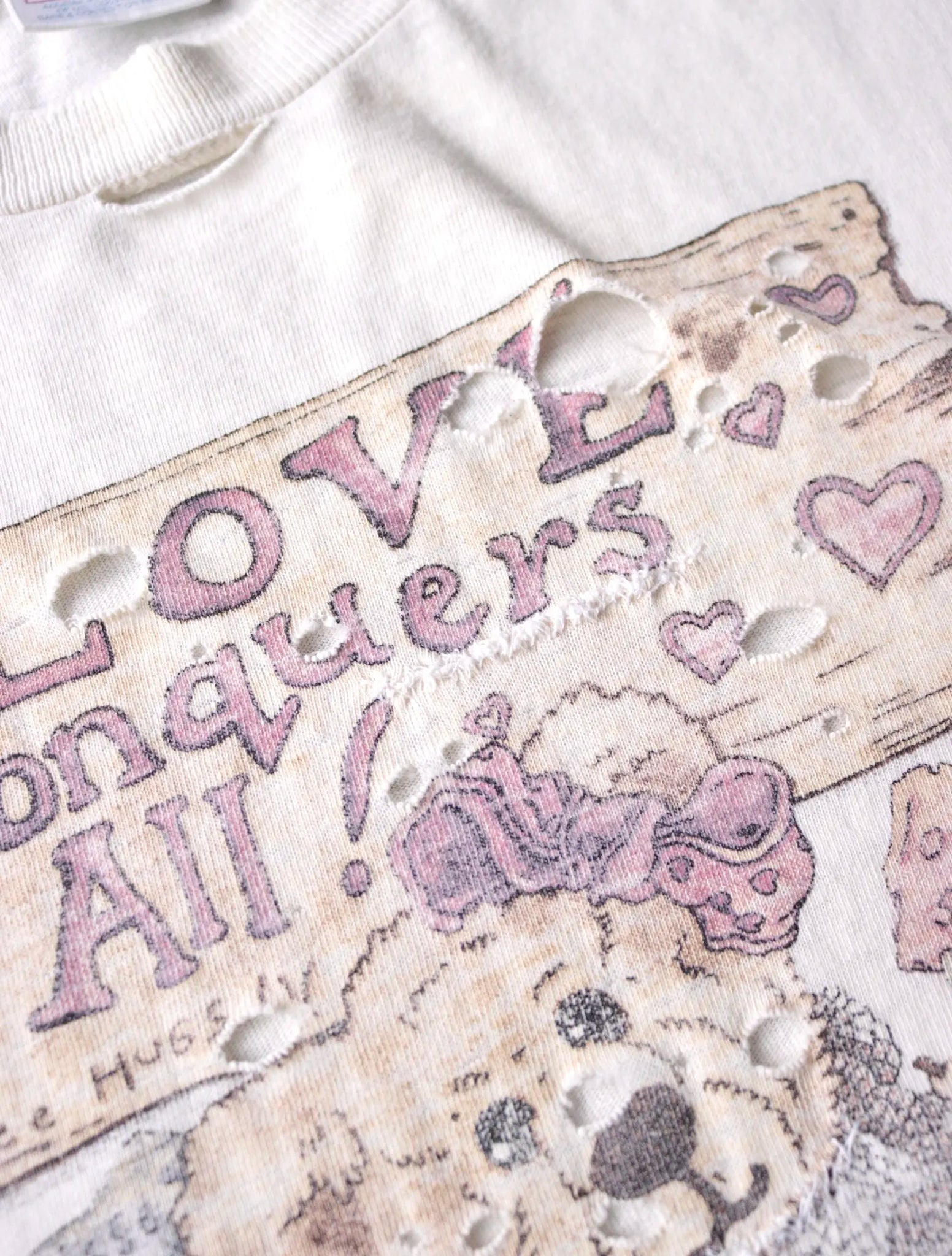 1990S LOVE CONQUERS ALL TEE
