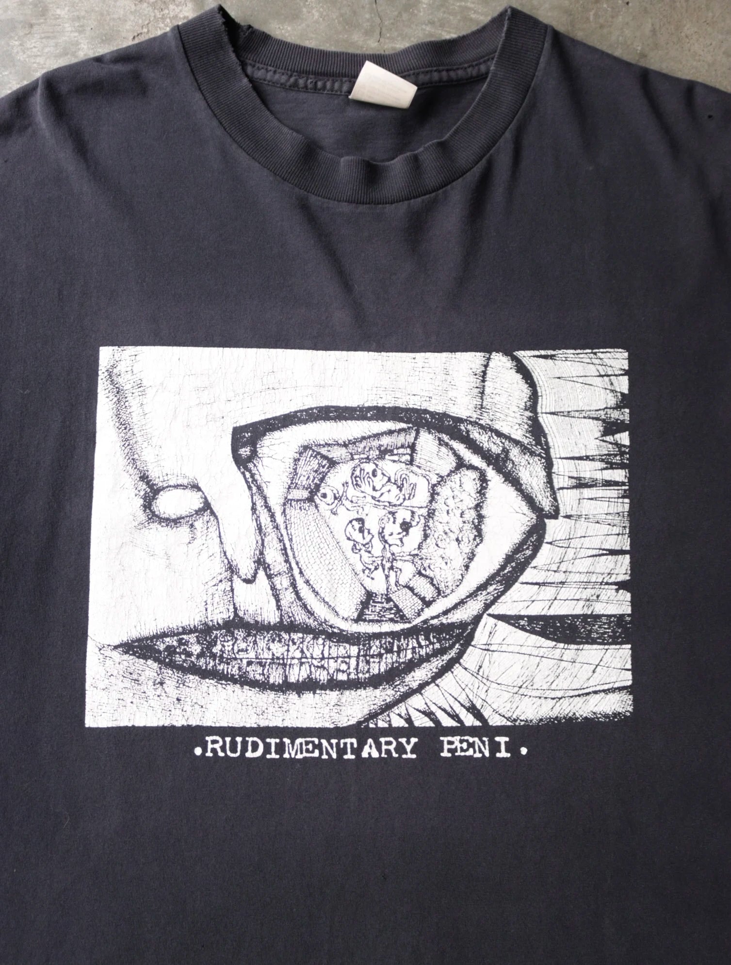 2000S RUDIMENTARY PENI. TEE