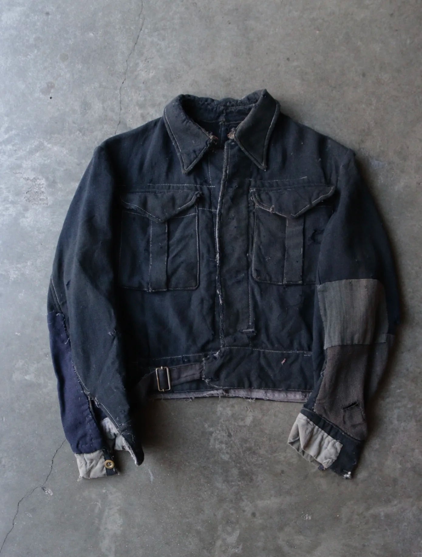 1920S FADED DISTRESSED AND REPAIRED JACKET