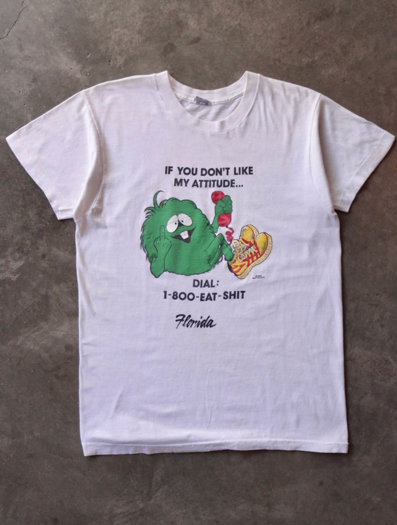 1980S DIAL 1-800-EAT-SH*T TEE