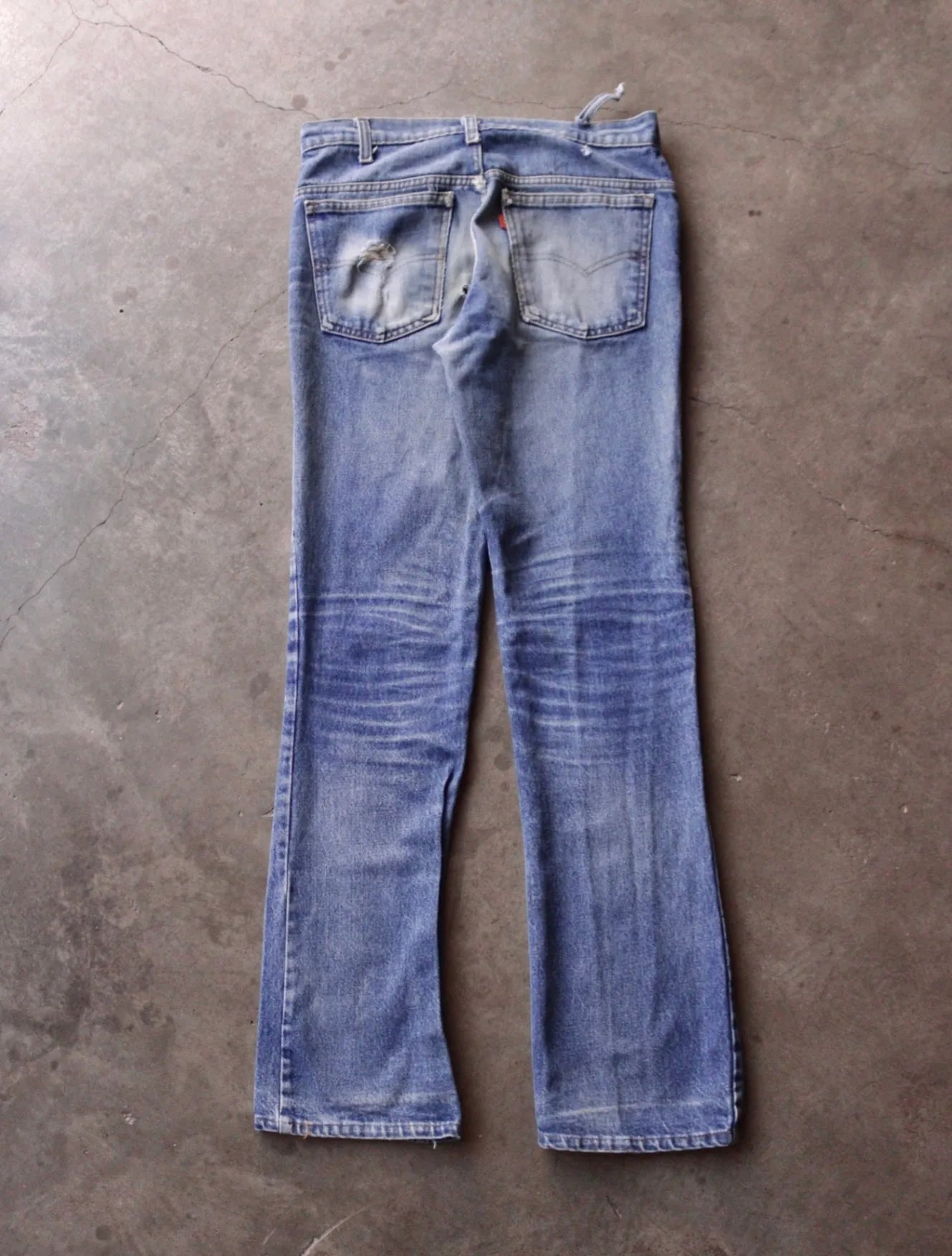 1970S DISTRESSED ORANGE TAB LEVI'S FLARED DENIM PANTS