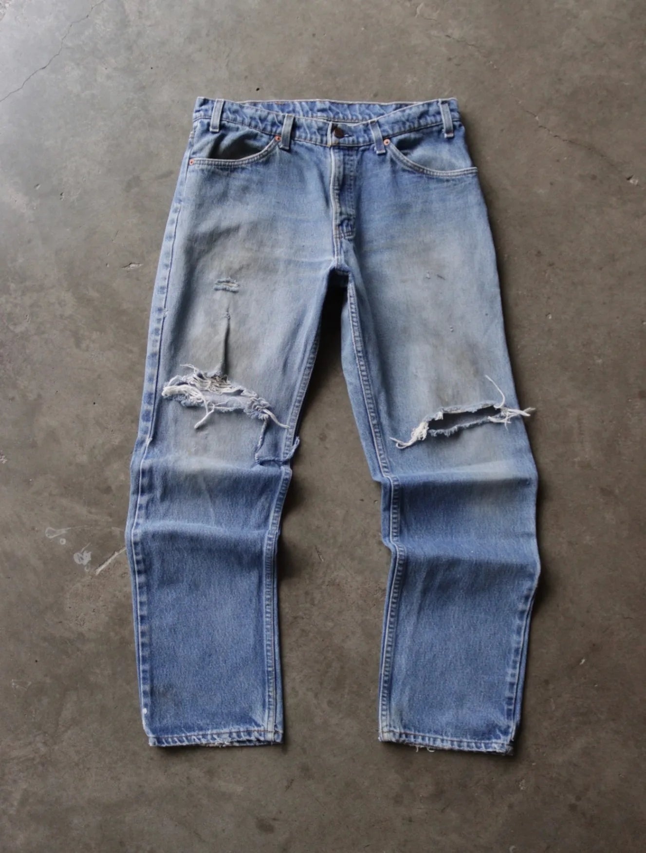 1980S DISTRESSED ORANGE TAB LEVI'S DENIM PANTS