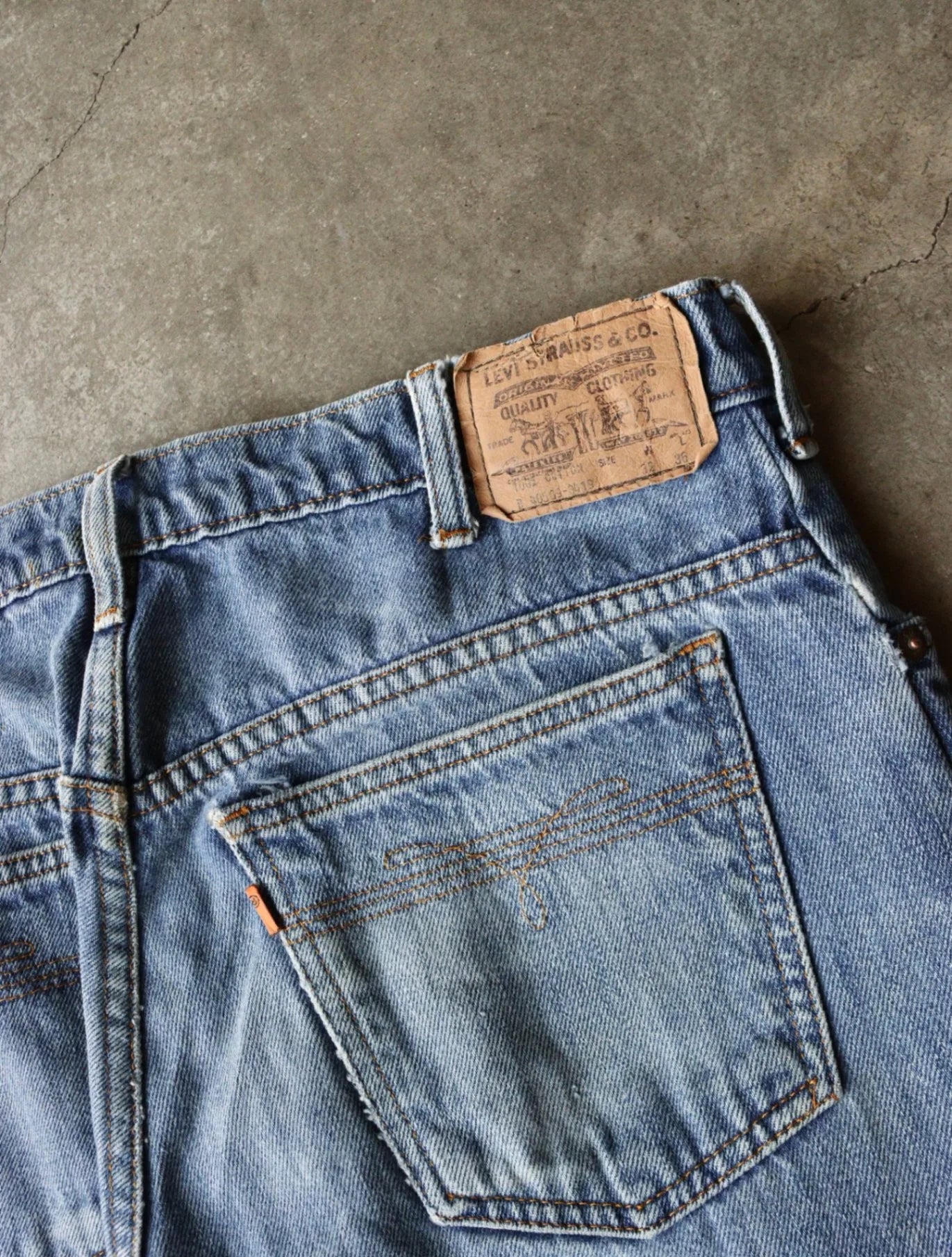 1980S ORANGE TAB DENIM PANTS